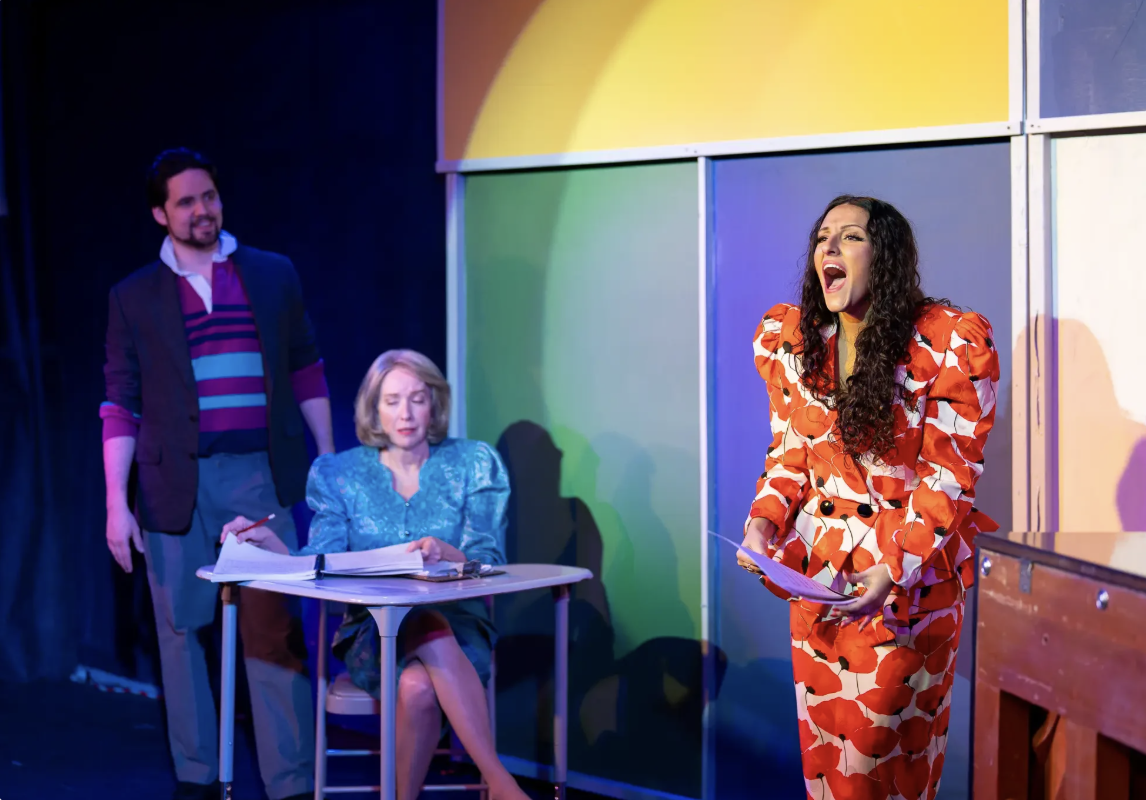 Three actors on stage.
